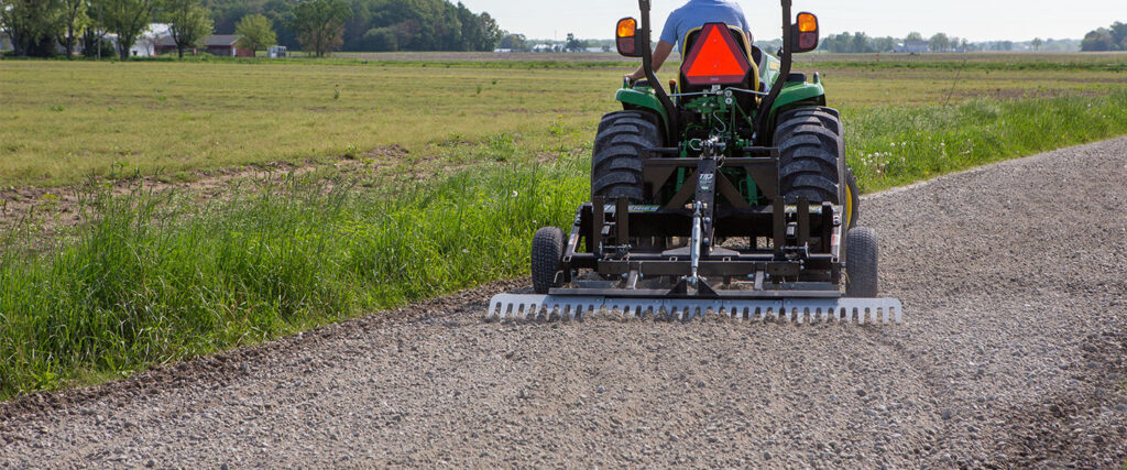 ABI Attachments TR3 grading a gravel driveway