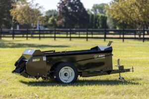 ABI Attachments 50 Cubic Foot Ground Drive Manure Spreader in a field