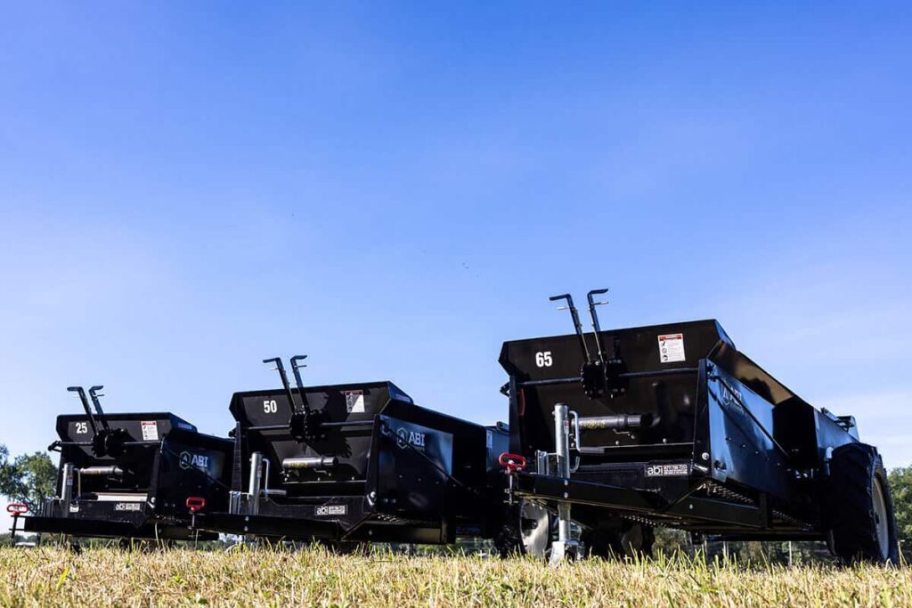 ABI Attachments 25 50 65 Cubic Foot Ground Drive Manure Spreader family of products next to each other