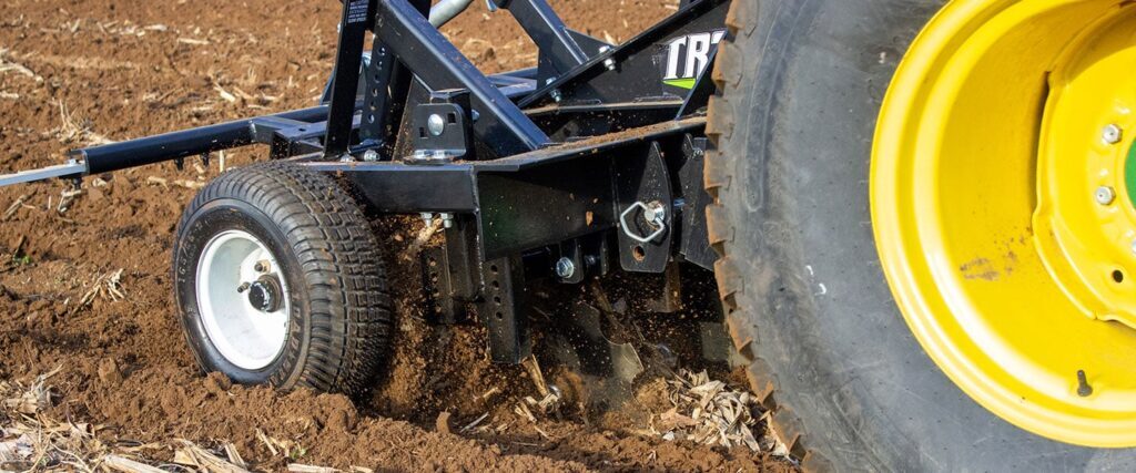 Flood plot disc in use, while attached to a tractor.