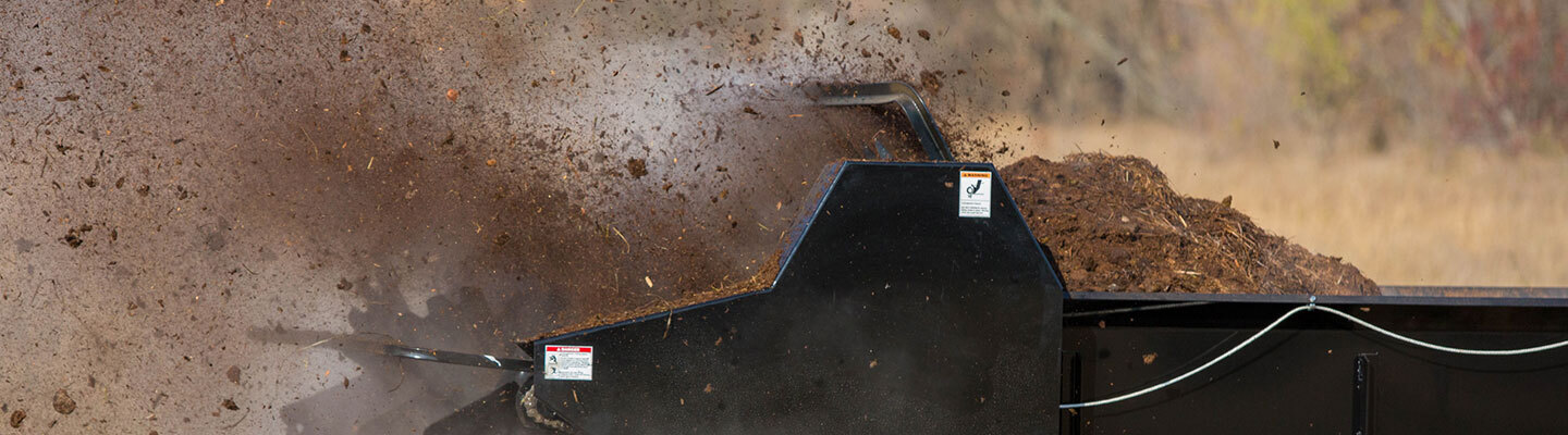 ABI Attachments Manure Spreader shredding and spreading manure