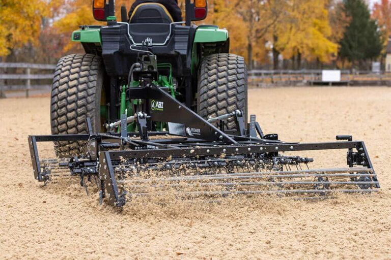 ABI Attachments SportPro M5 Arena Drag being used in an outdoor arena with synthetic footing