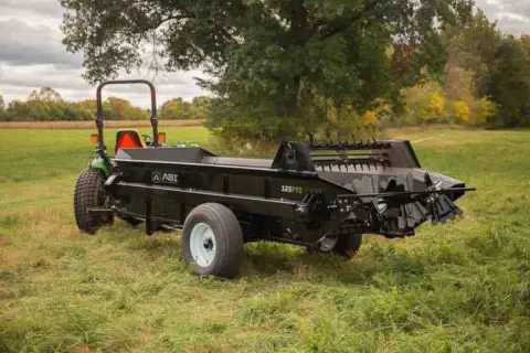Tractor 125 PTO Manure Spreader being displayed.