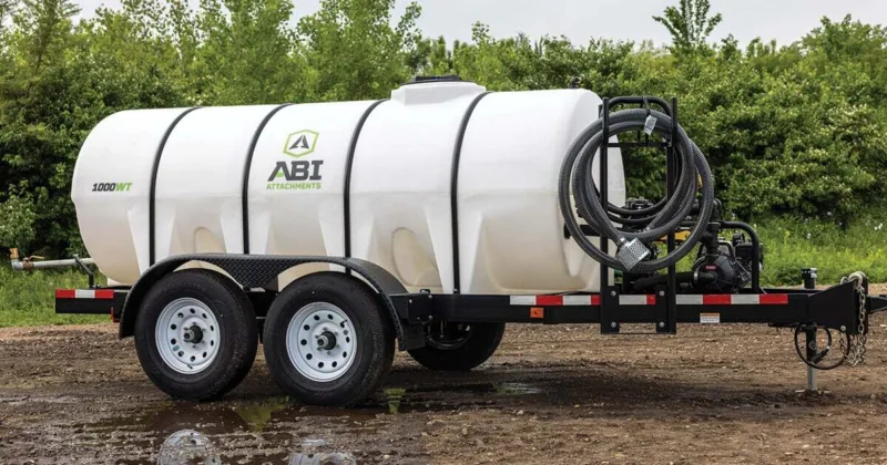 A sprayer trailer with a large tank attached, ready for agricultural use.