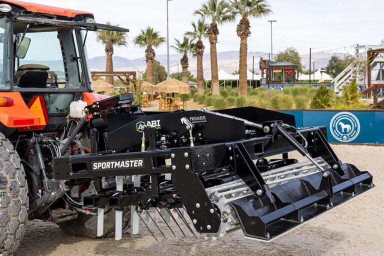 ABI Sportmaster Pro in a arena, surrounded by palm trees.