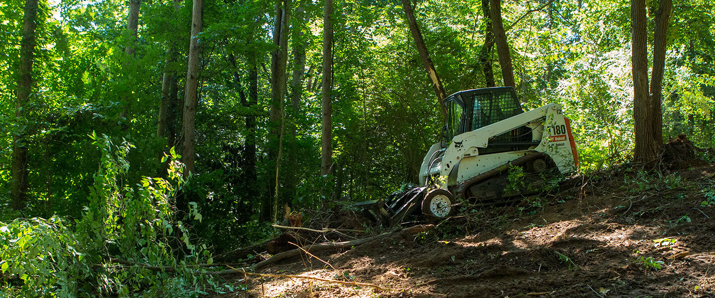 Clearing land with ABI skid steer rake