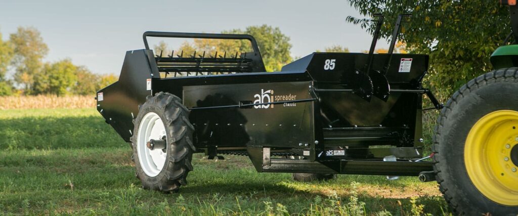 Front view of an ABI Attachments 85 Cubic Foot Ground Drive Manure Spreader