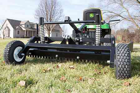 Stabilizing wheels on ABI gravel grader.