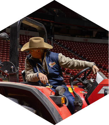 Randy Spraggins on a orange tractor.